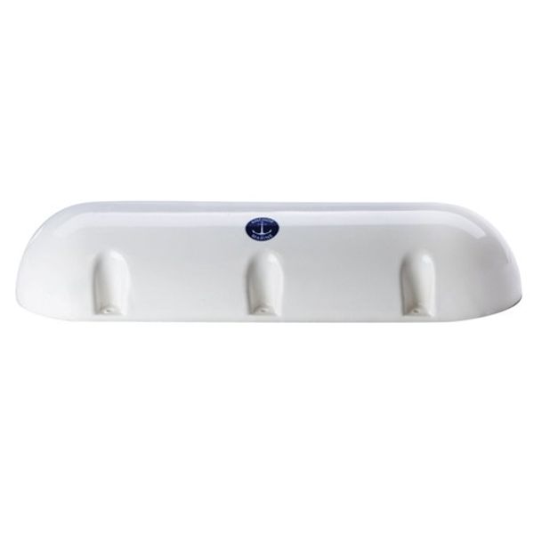 A white dock fender with a curved, semi-circular top, featuring a small blue circular emblem in the center.