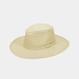 A light beige wide-brim sun hat with a structured crown, a textured band, and a small gold metal accent on the side, shown against a light gray background.